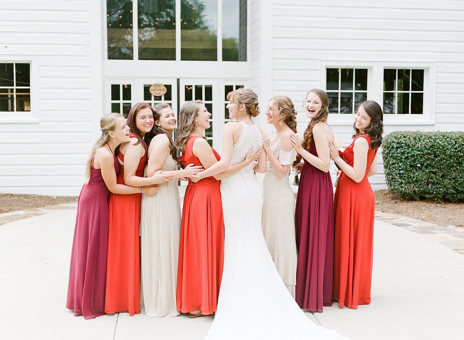 Dairy Barn Wedding Bride with Bridesmaids laughing Photo