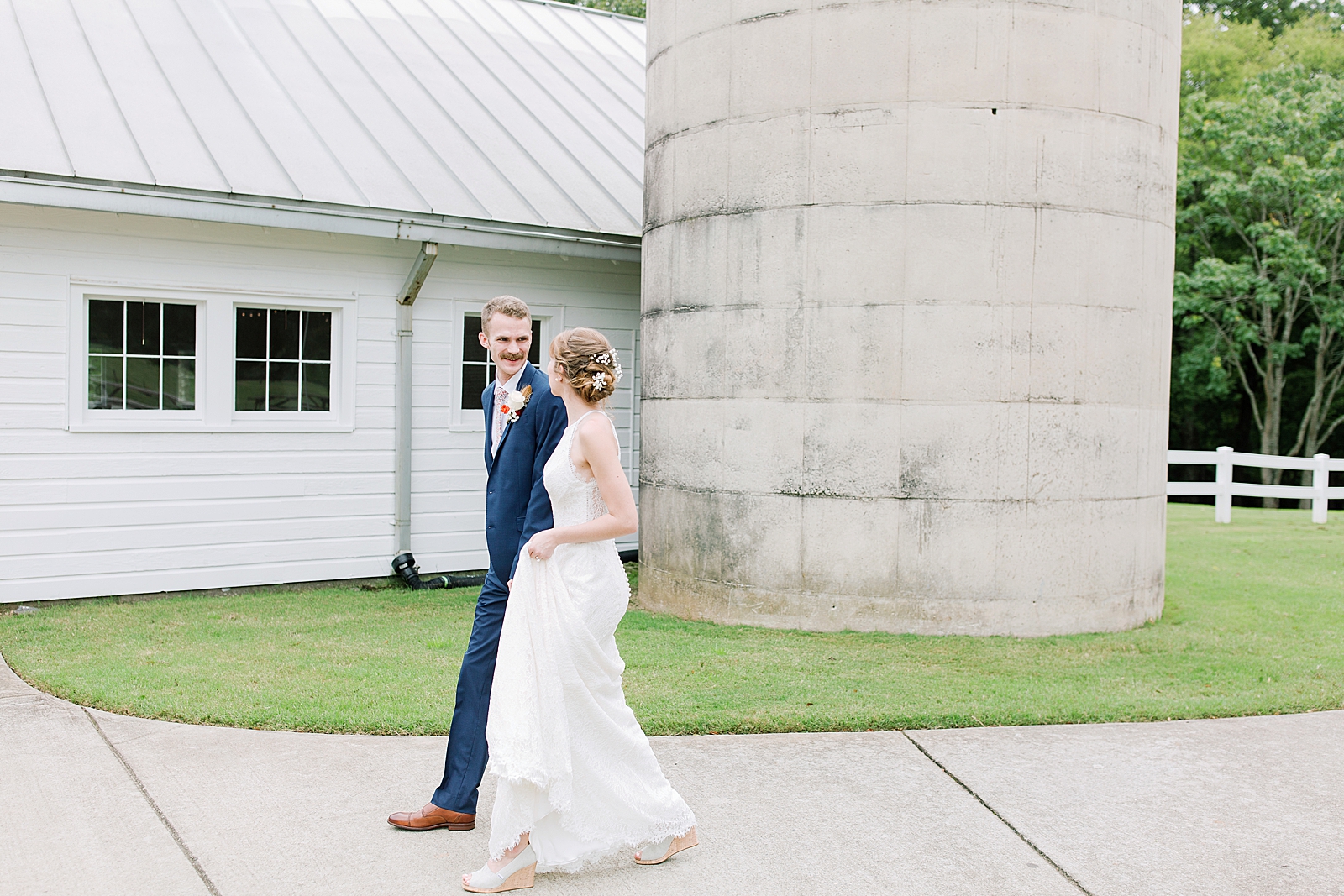 Dairy Barn Wedding Bride and Groom Walking on Sidewalk Photo