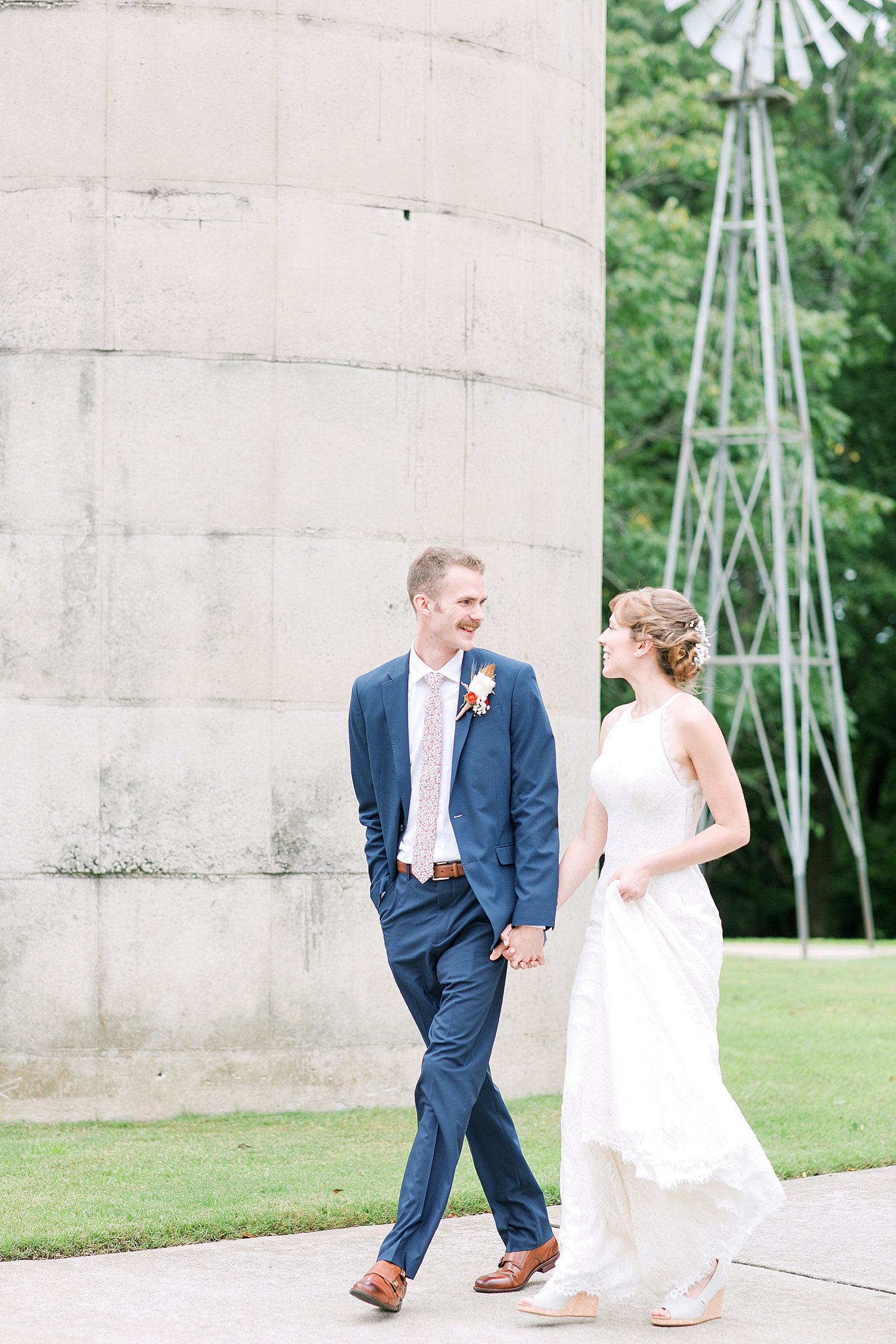 Dairy Barn Wedding Bride and Groom Walking Holding Hands Photo
