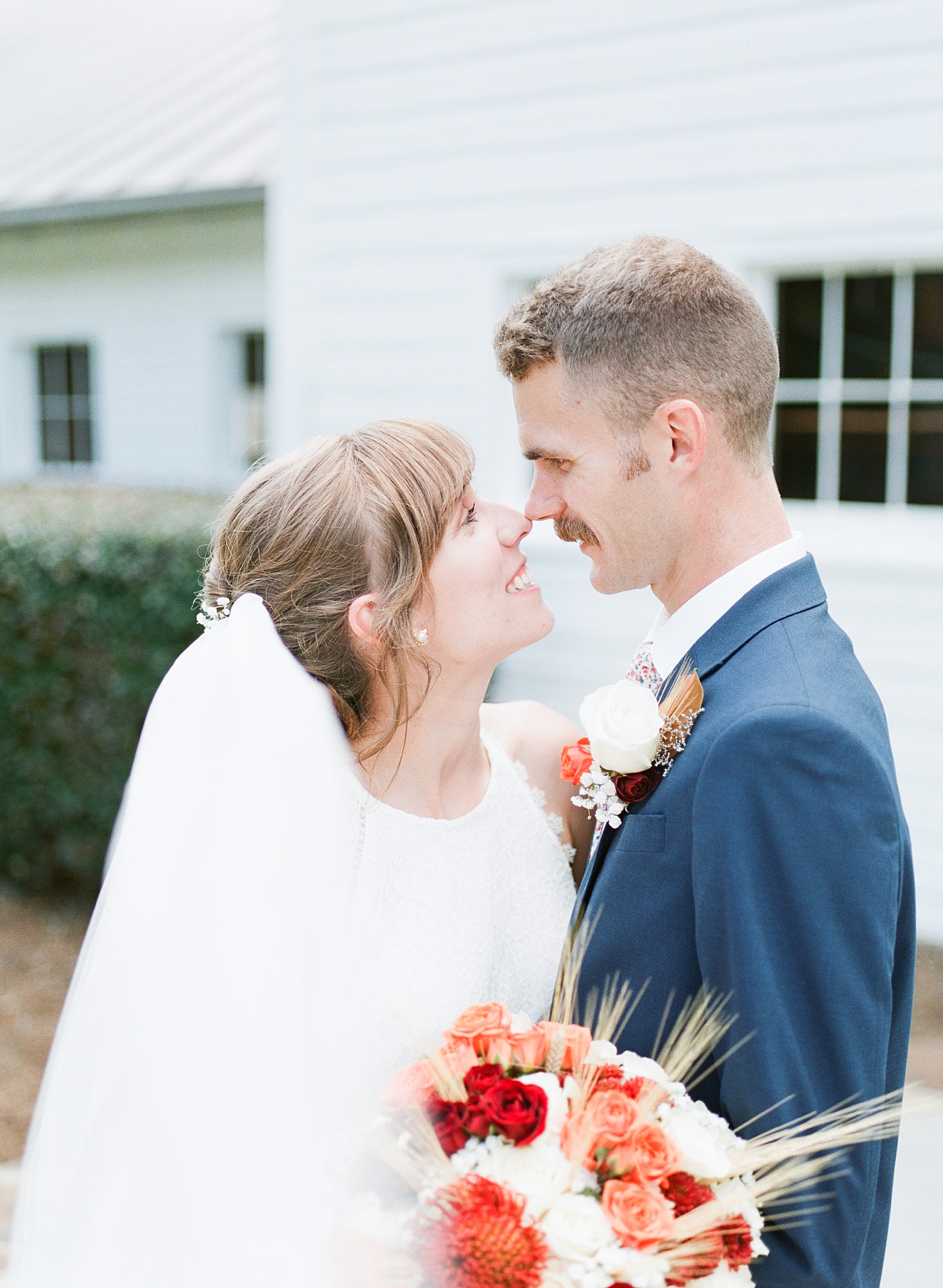 Dairy Barn Wedding Bride and Groom nose to nose Photo