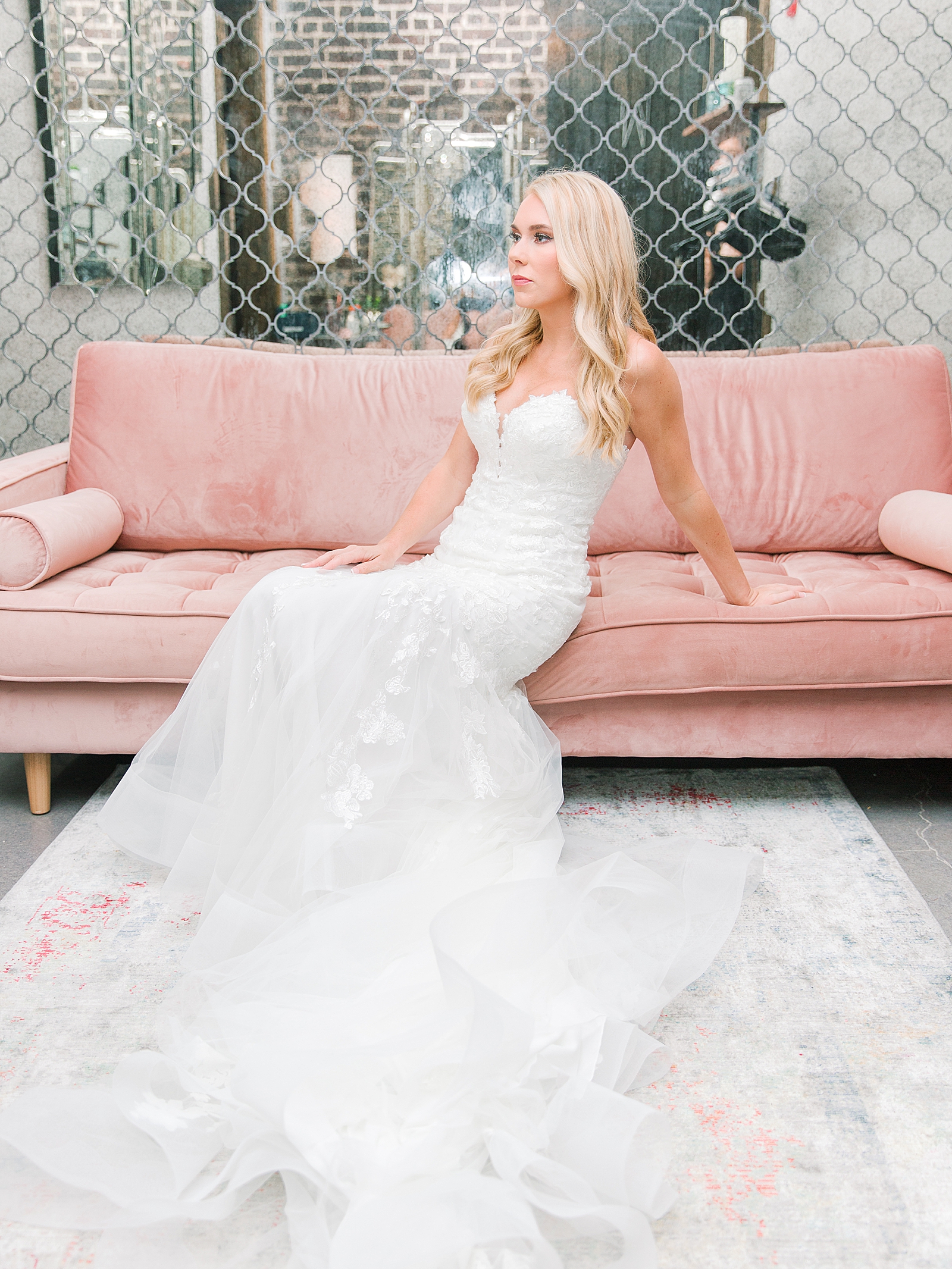 Glover Park Brewery Wedding Bride sitting on pink couch in bridal suite Photo