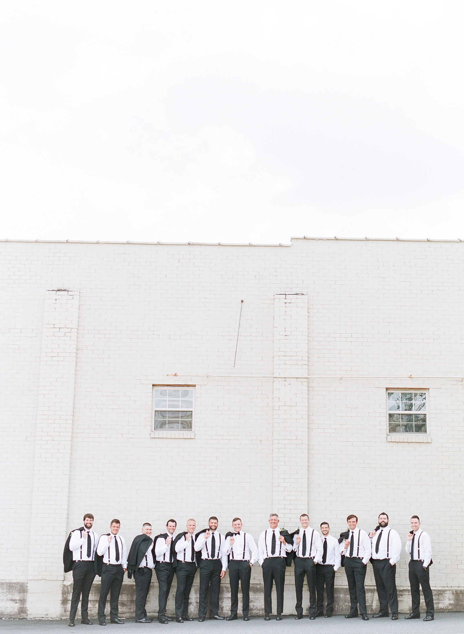 Glover Park Brewery Wedding Groom and Groomsmen with jackets over their shoulder Photo