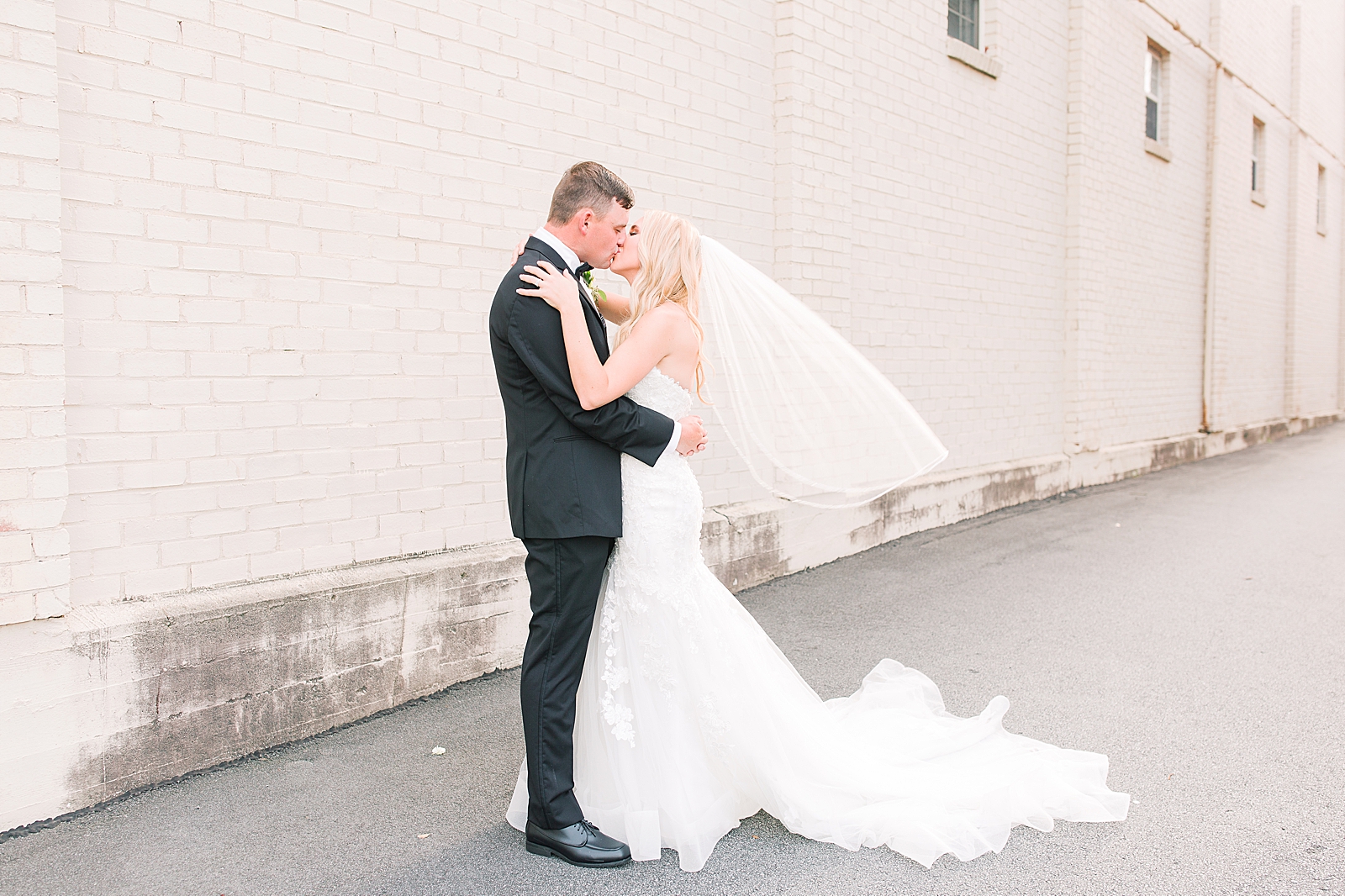Glover Park Brewery Wedding Bride and Groom Kissing with Veil Blowing Photo