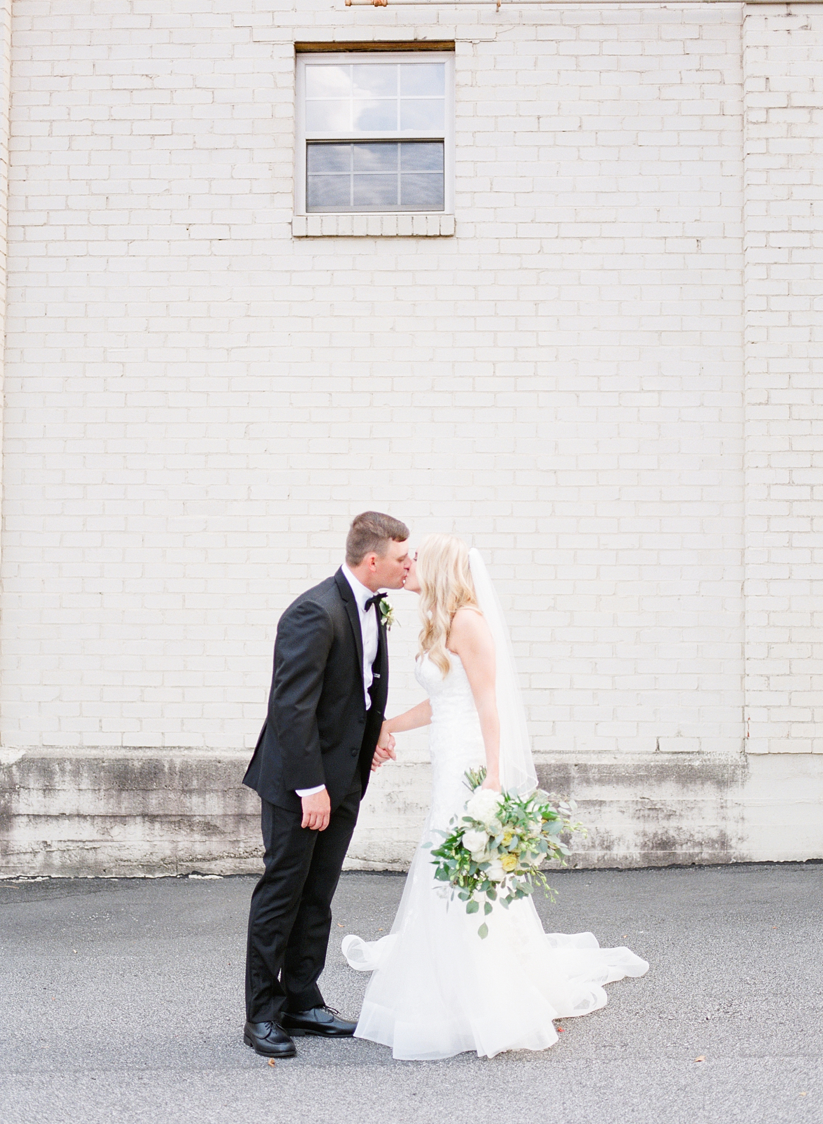 Glover Park Brewery Wedding Bride and Groom Kissing Holding Hands Photo
