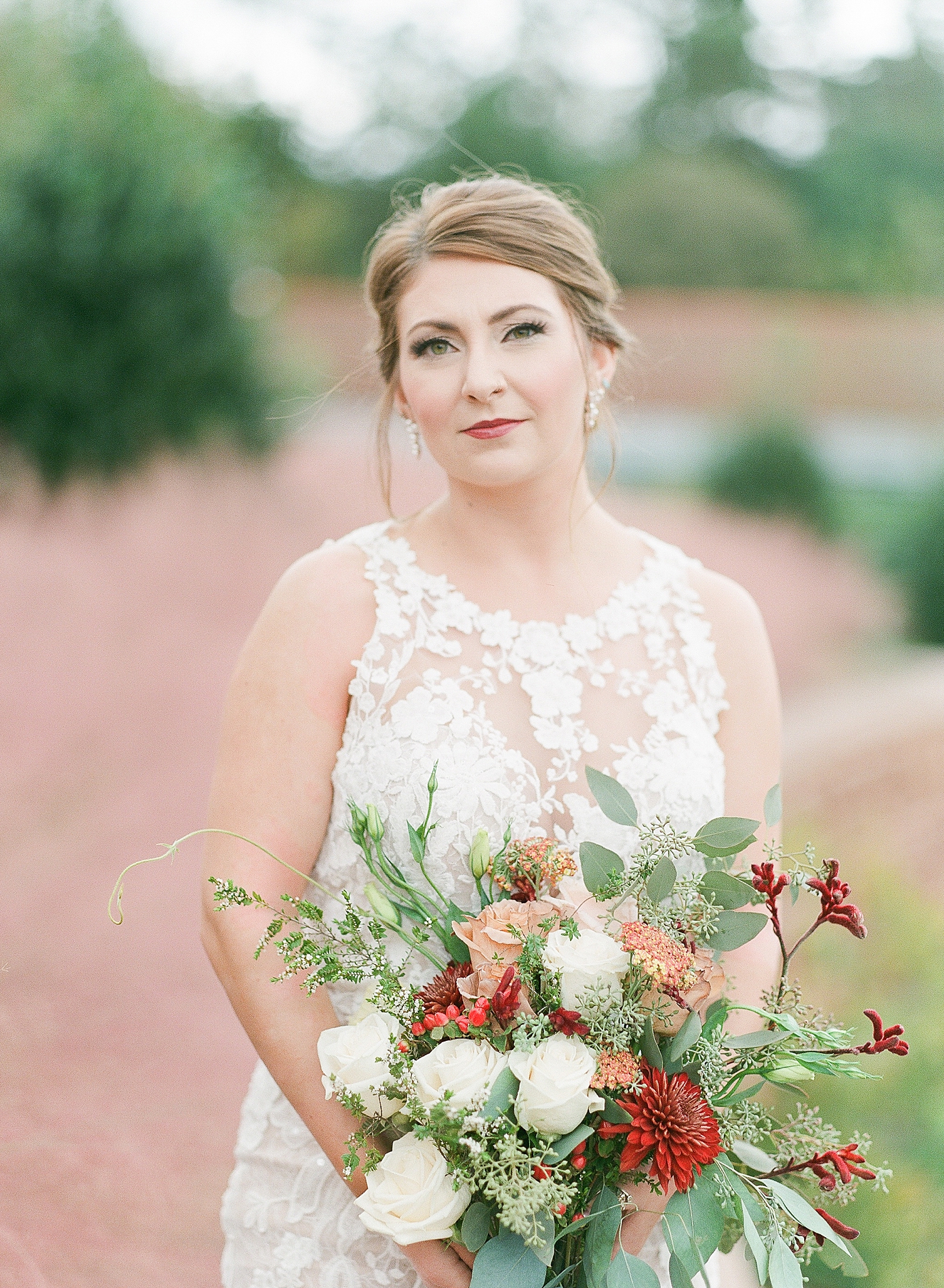 Asheville Bridal Editorial Bride looking at Camera holding bouquet Photo