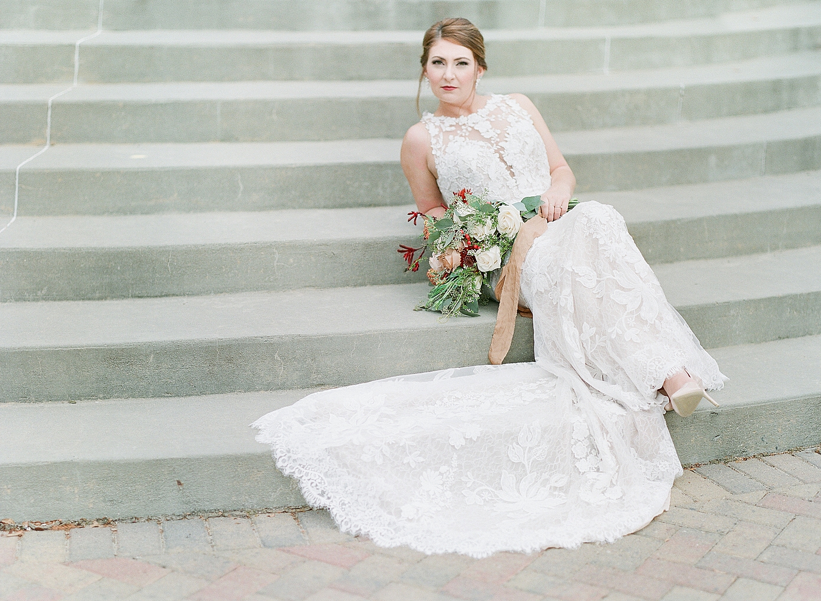 Asheville Bridal Editorial Bride Sitting on Stairs looking at Camera Photo
