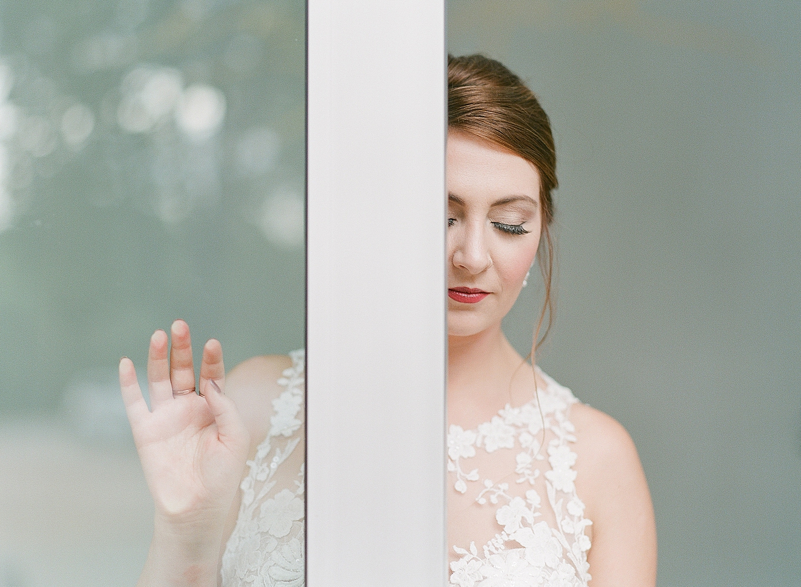 Asheville Bridal Editorial Bride Behind Door Looking Down Photo