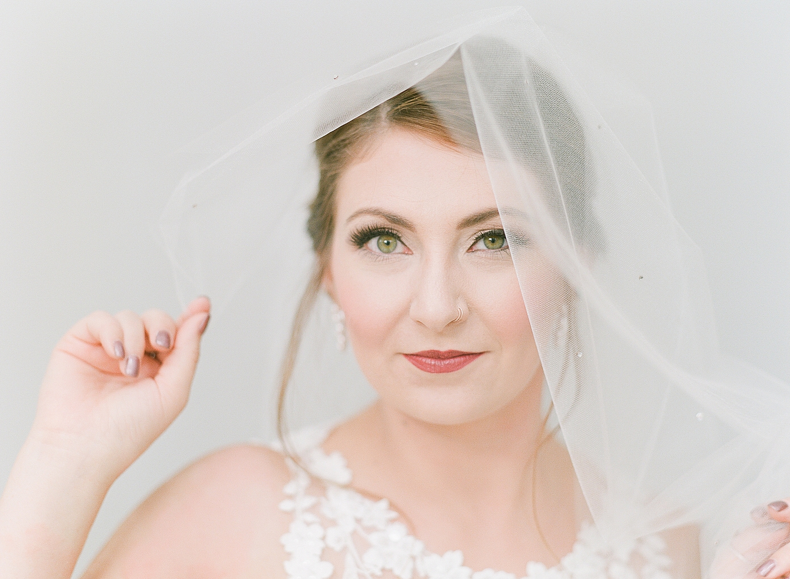 Asheville Bridal Editorial Bride Looking at Camera with Veil Photo