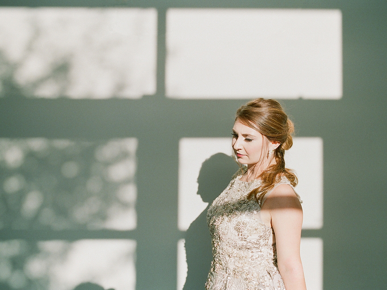 Asheville Bridal Editorial Bride Looking Down with Window Shadows Photo