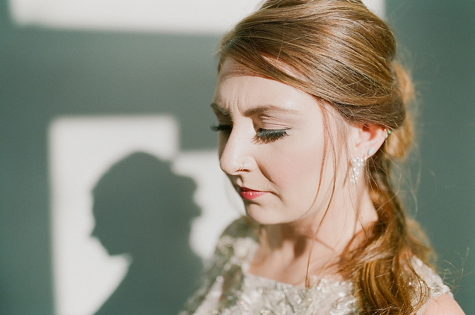 Asheville Bridal Editorial Bride Looking Down Her Shadow on the Wall Photo