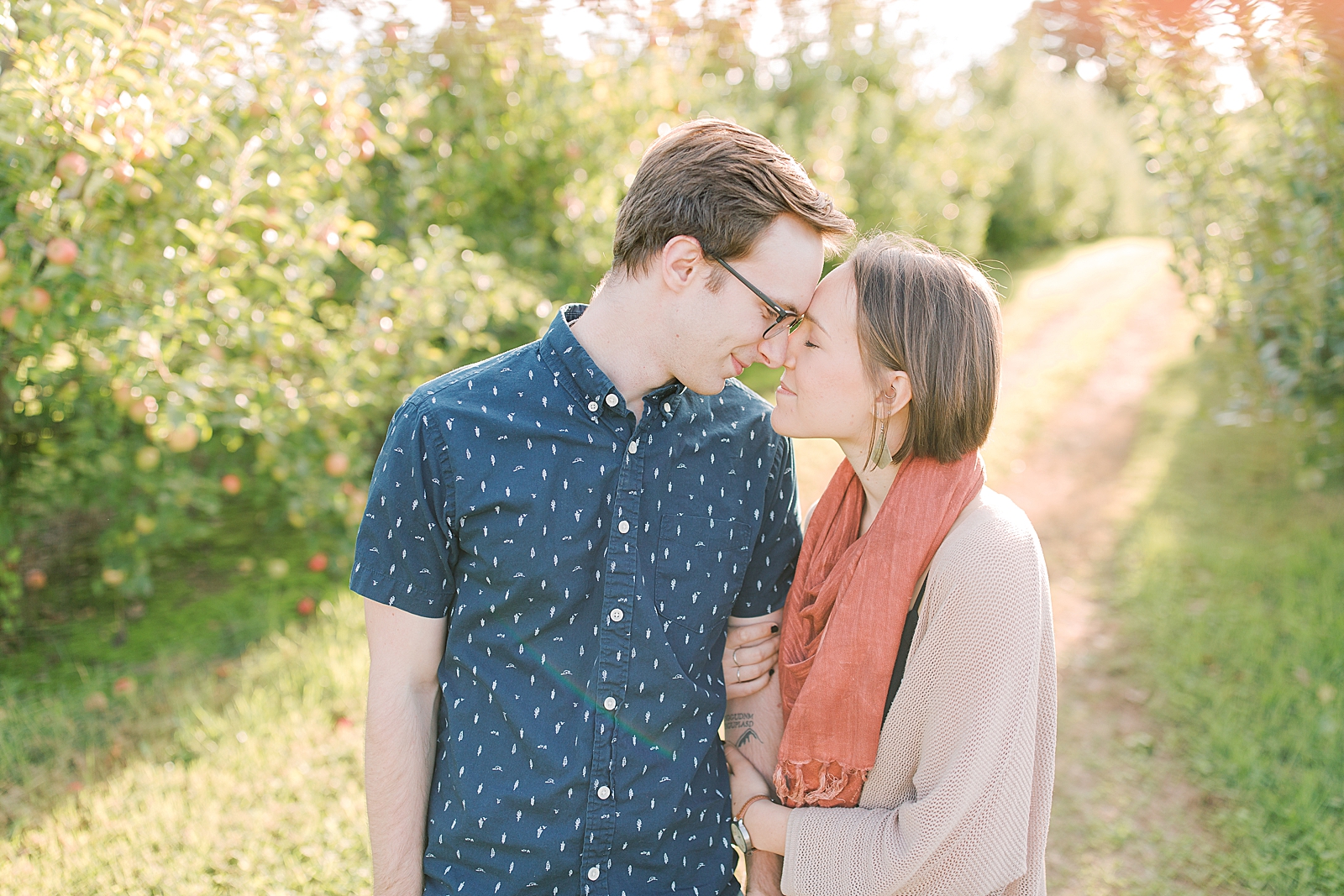 Downtown Asheville Engagement Session Couple Nose to Nose in Orchard Photo