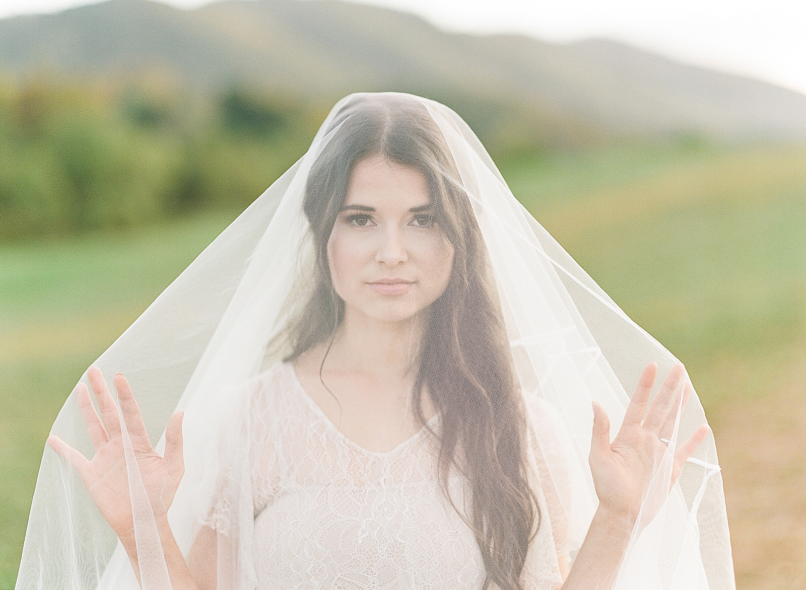 Asheville Wedding Photographer Bridal Editorial Bride with Veil over her face looking at camera Photo