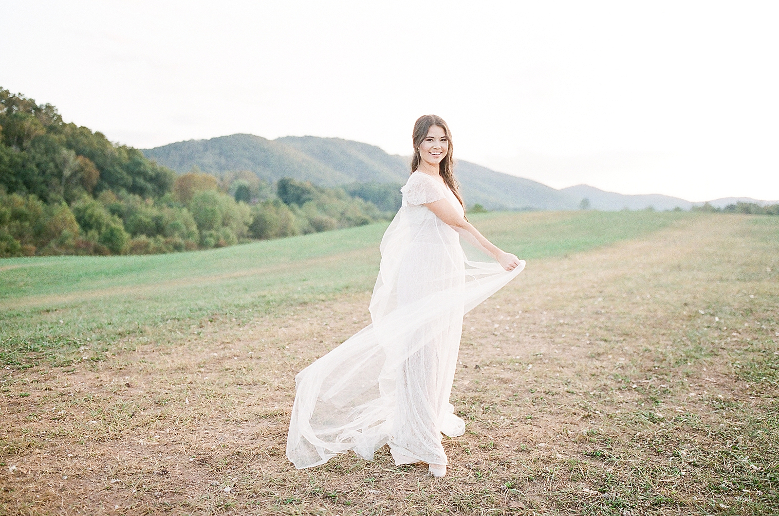 Asheville Wedding Photographer Bridal Editorial Bride Spinning in Field Photo