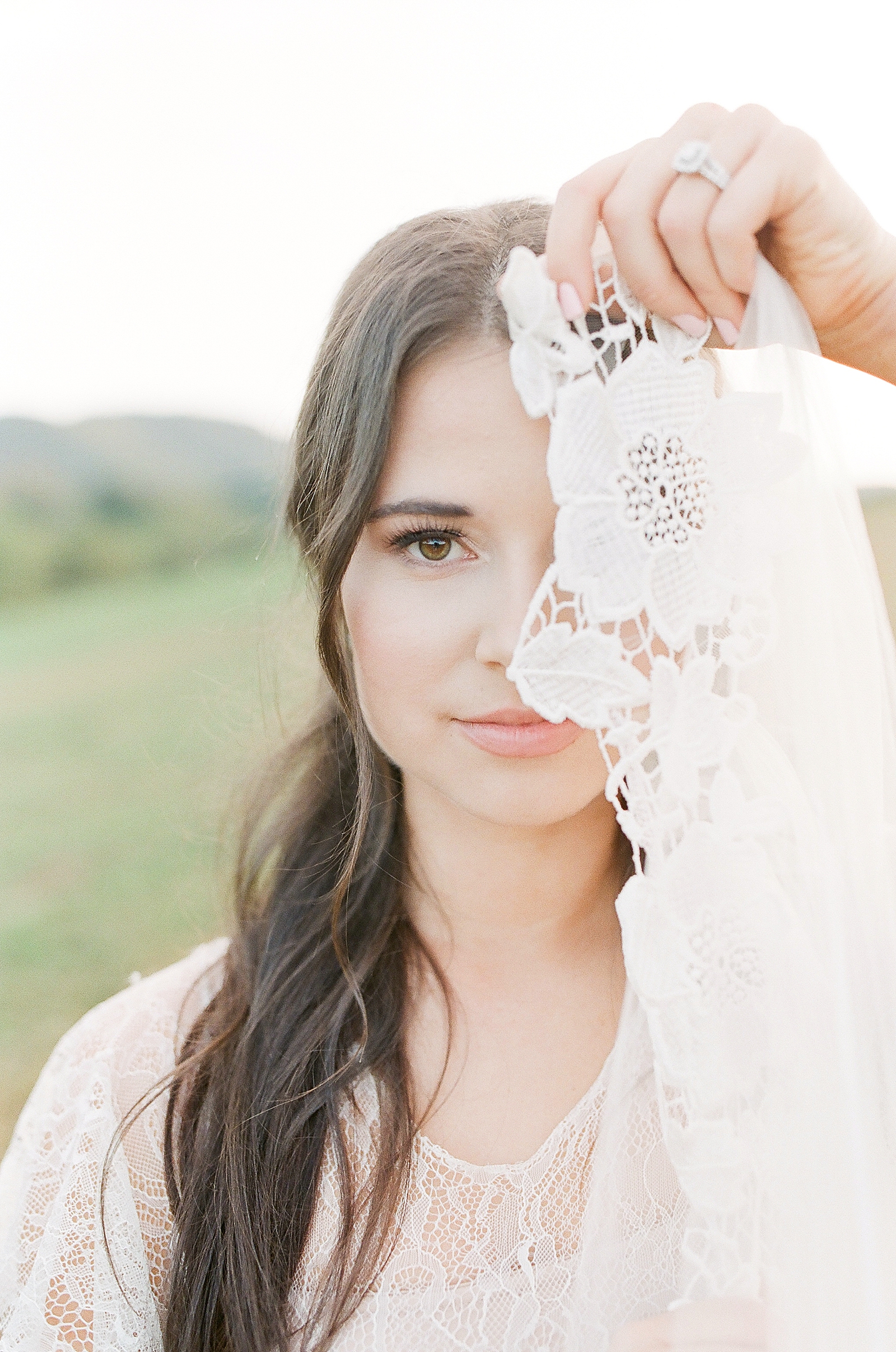Asheville Wedding Photographer Bridal Editorial Bride Holding Lace in front of her face Photo