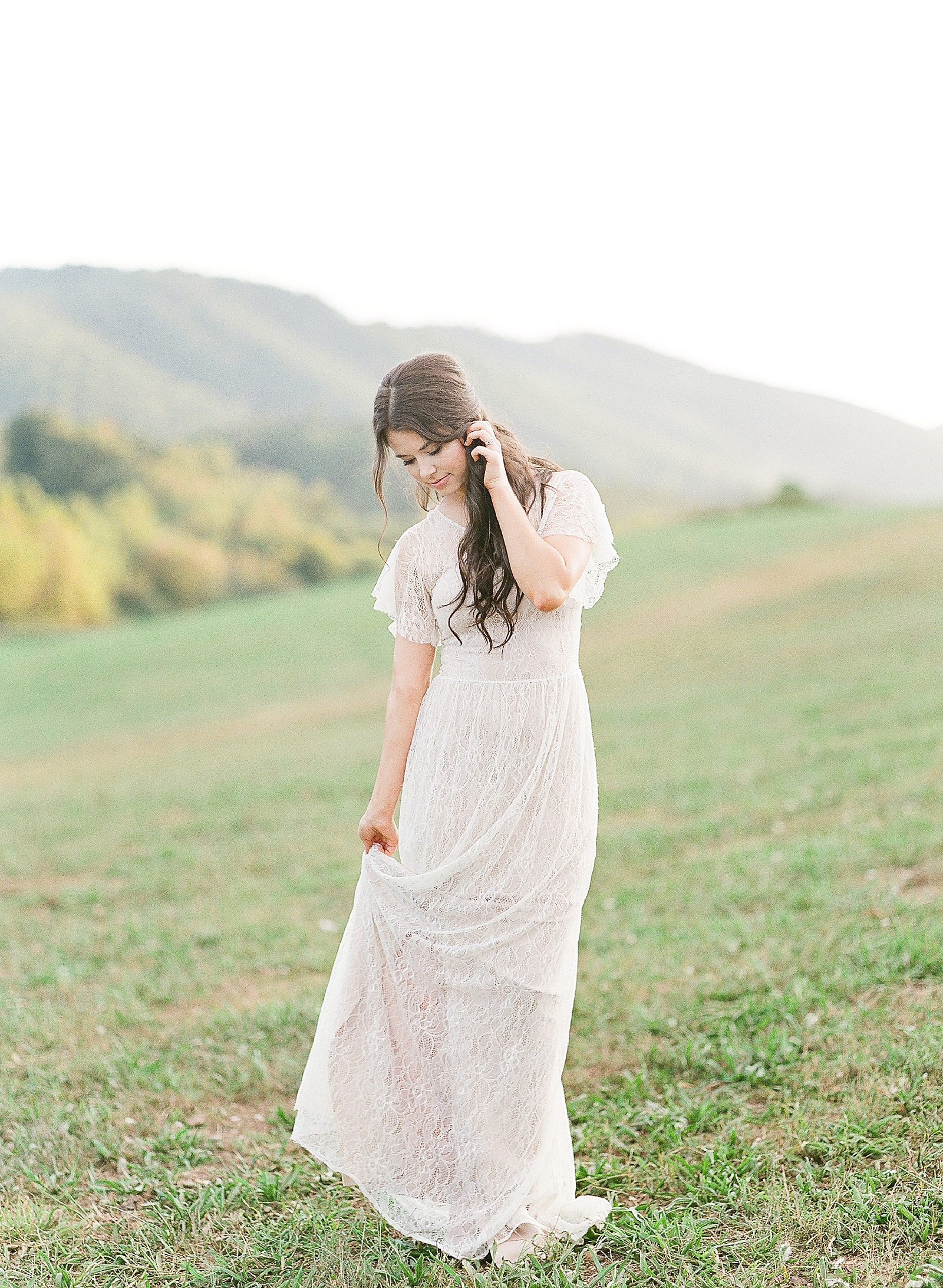 Asheville Wedding Photographer Bridal Editorial Bride Looking Down Holding Dress Photo