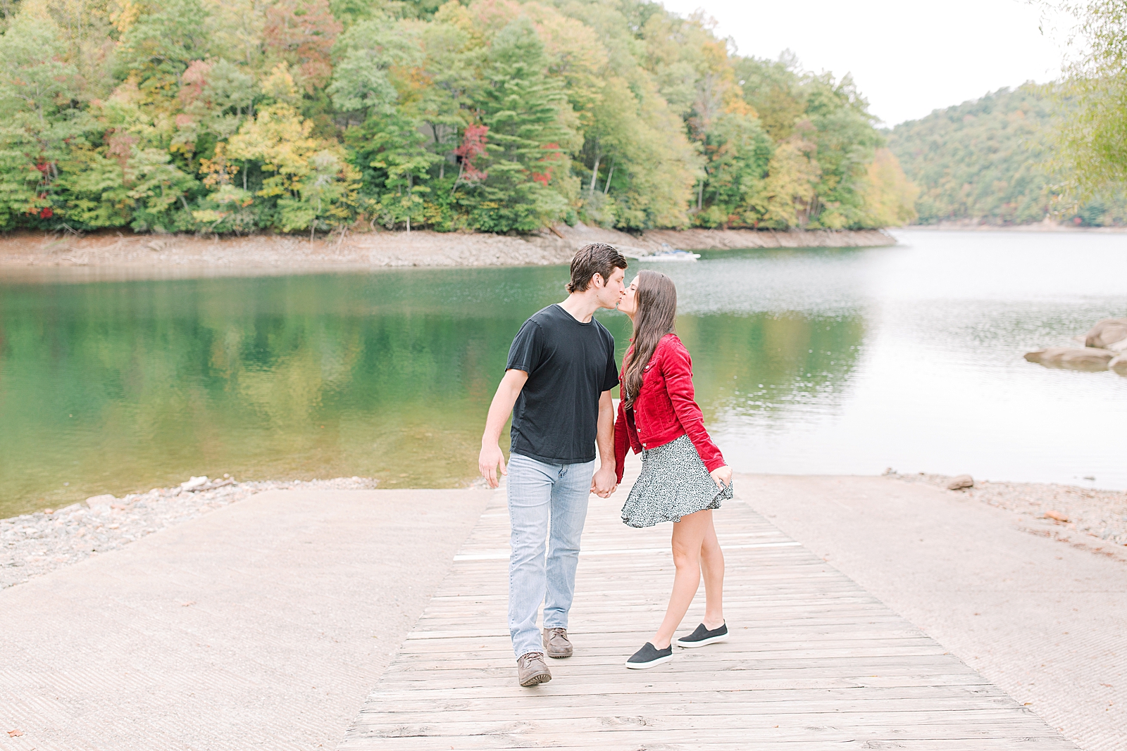 Mountaintop Engagement Couple Kissing on Dock Photo 