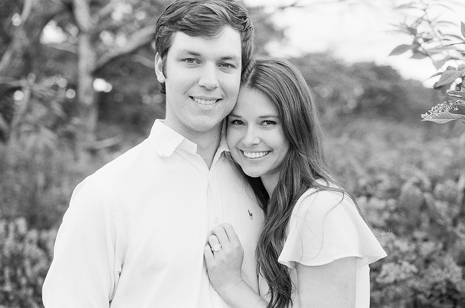 Mountaintop Engagement Black and White of Couple Smiling at camera Photo 