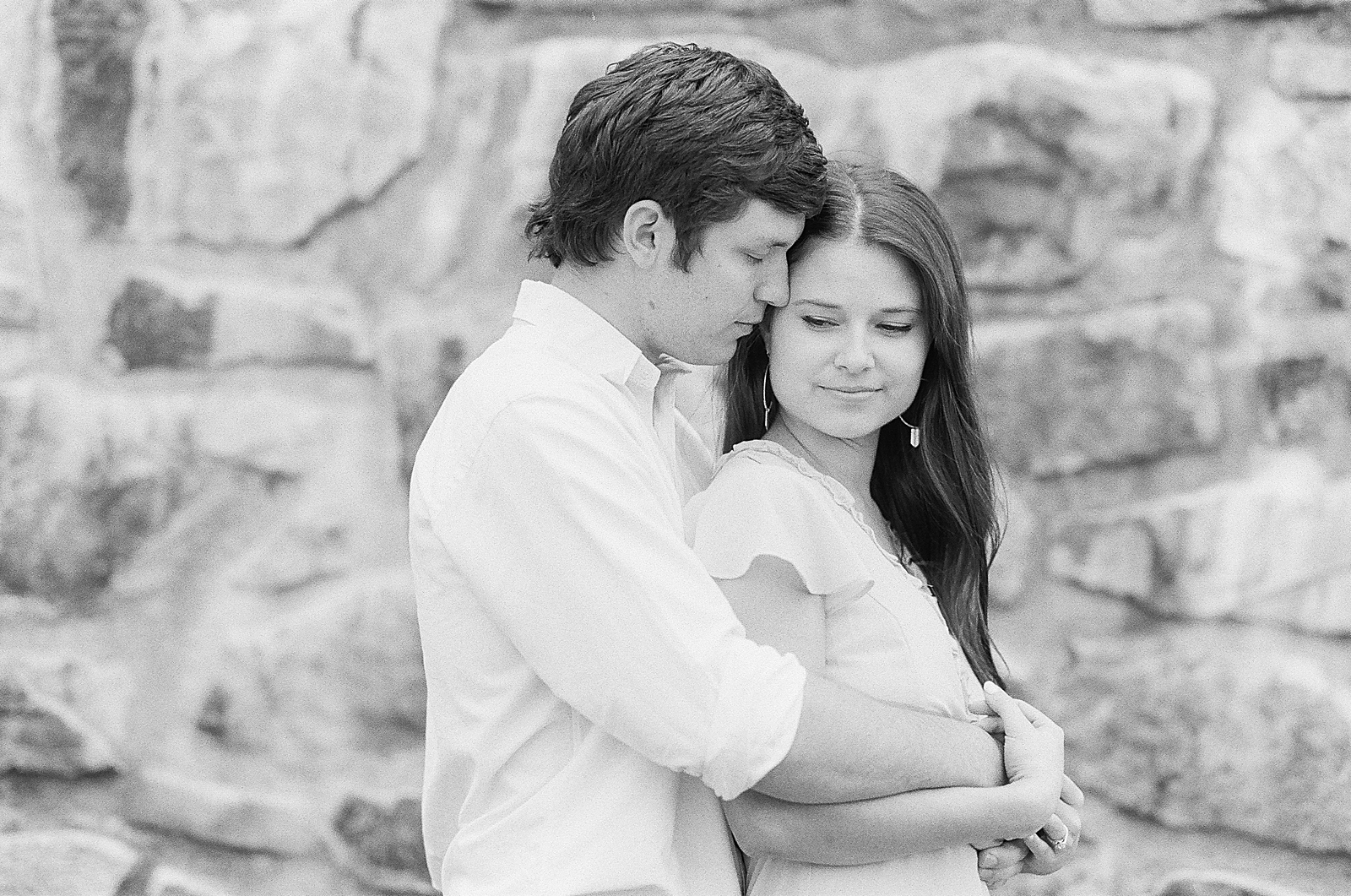 Mountaintop Engagement Black and White of Couple Snuggling Photo 
