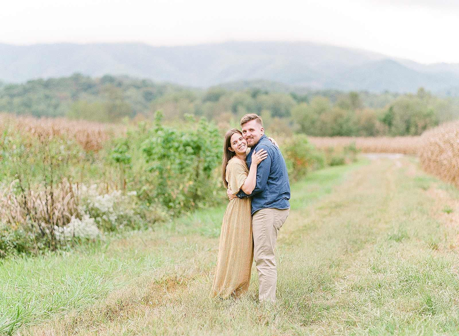  North Carolina Mountain Engagement Session Couple Hugging and Smiling at the Camera Photo