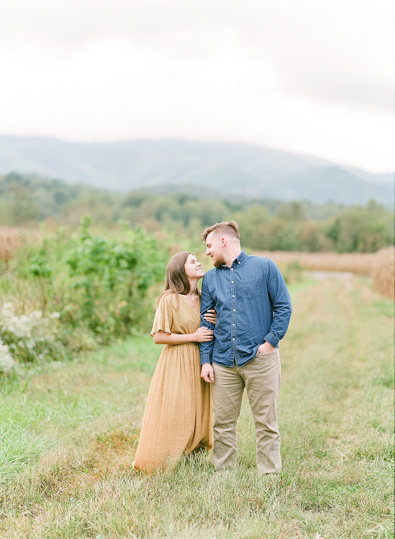  North Carolina Mountain Engagement Session Couple Smiling at Each Other Photo