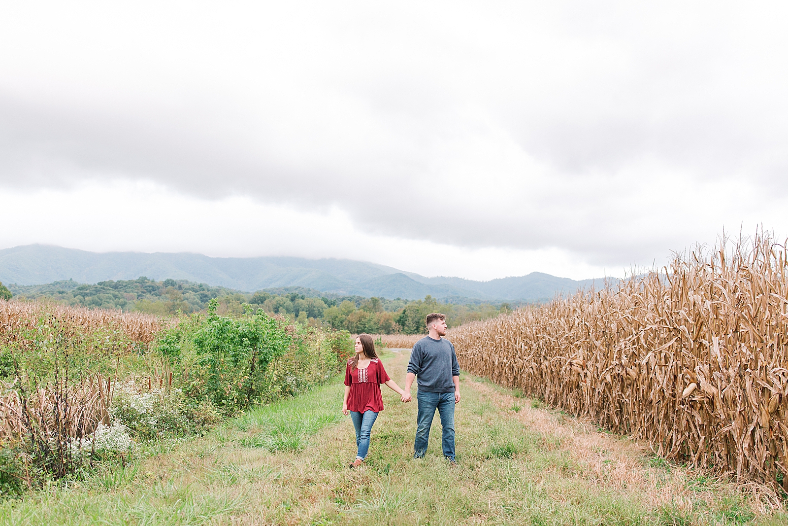  North Carolina Mountain Engagement Session Couple Holding Hands Looking Off Photo