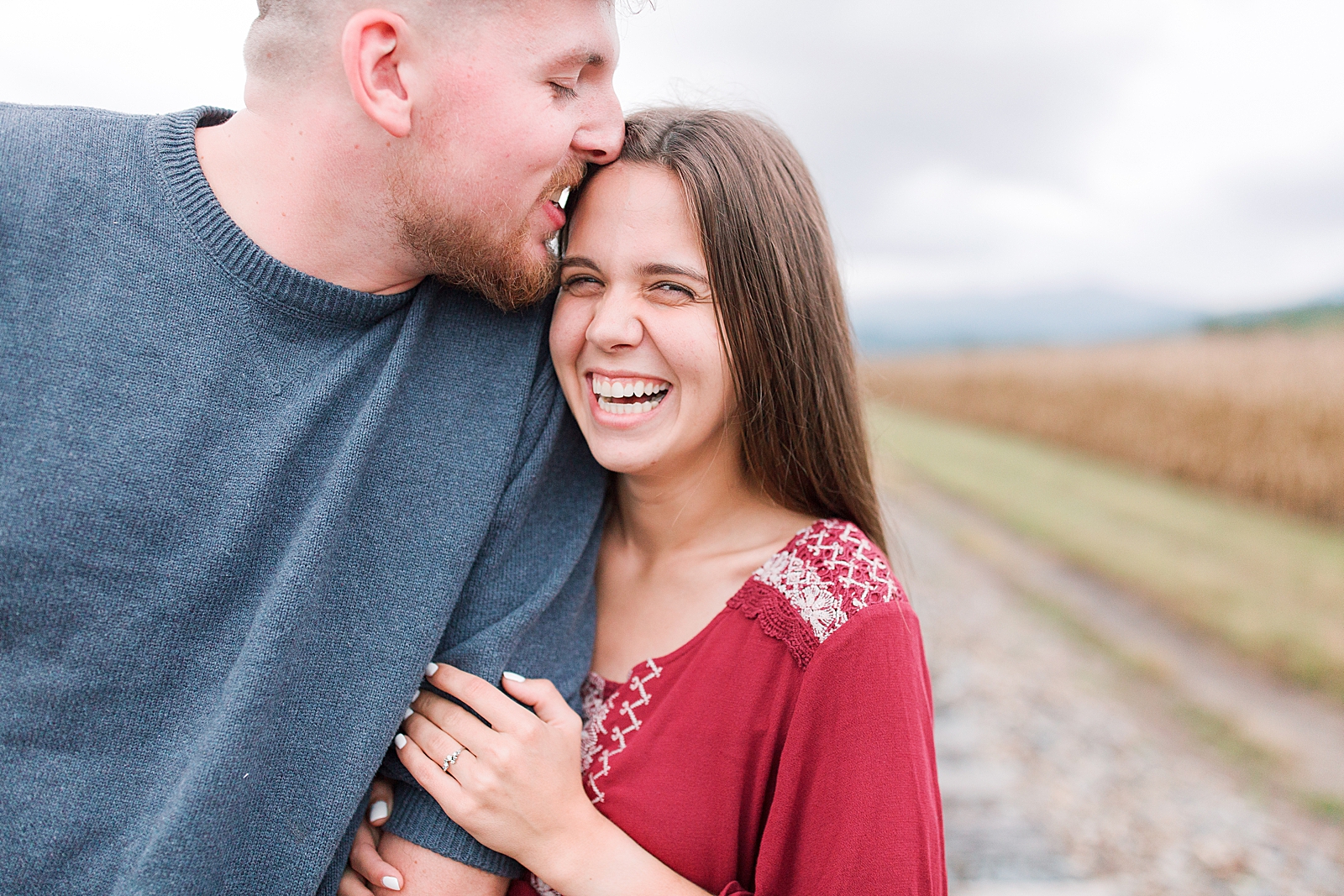  North Carolina Mountain Engagement Session Couple Snuggling and Laughing Photo