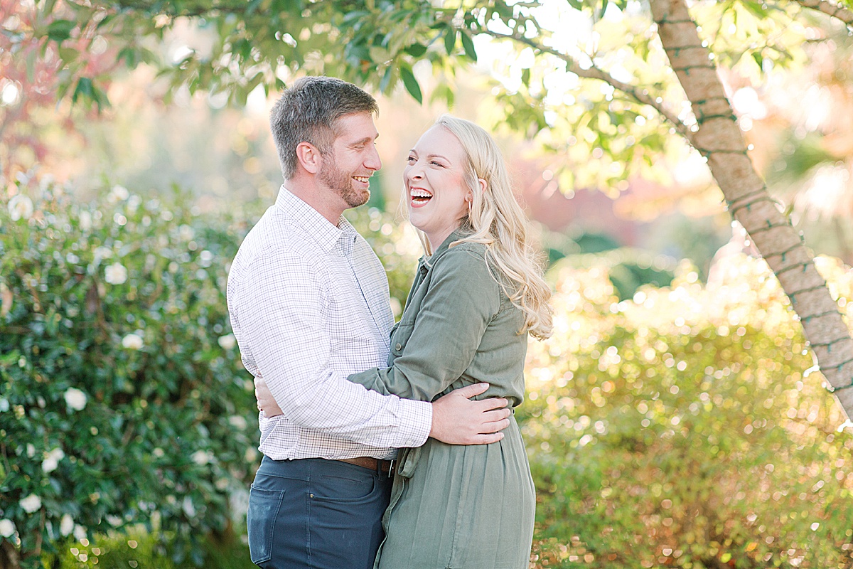 Asheville Arboretum Engagement Session Couple Hugging and Laughing Photo