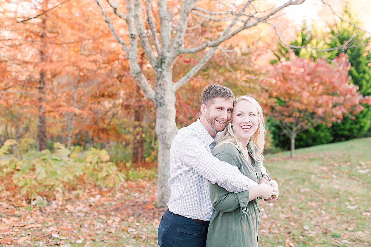 Asheville Arboretum Engagement Session Couple Laughing and Hugging Photo