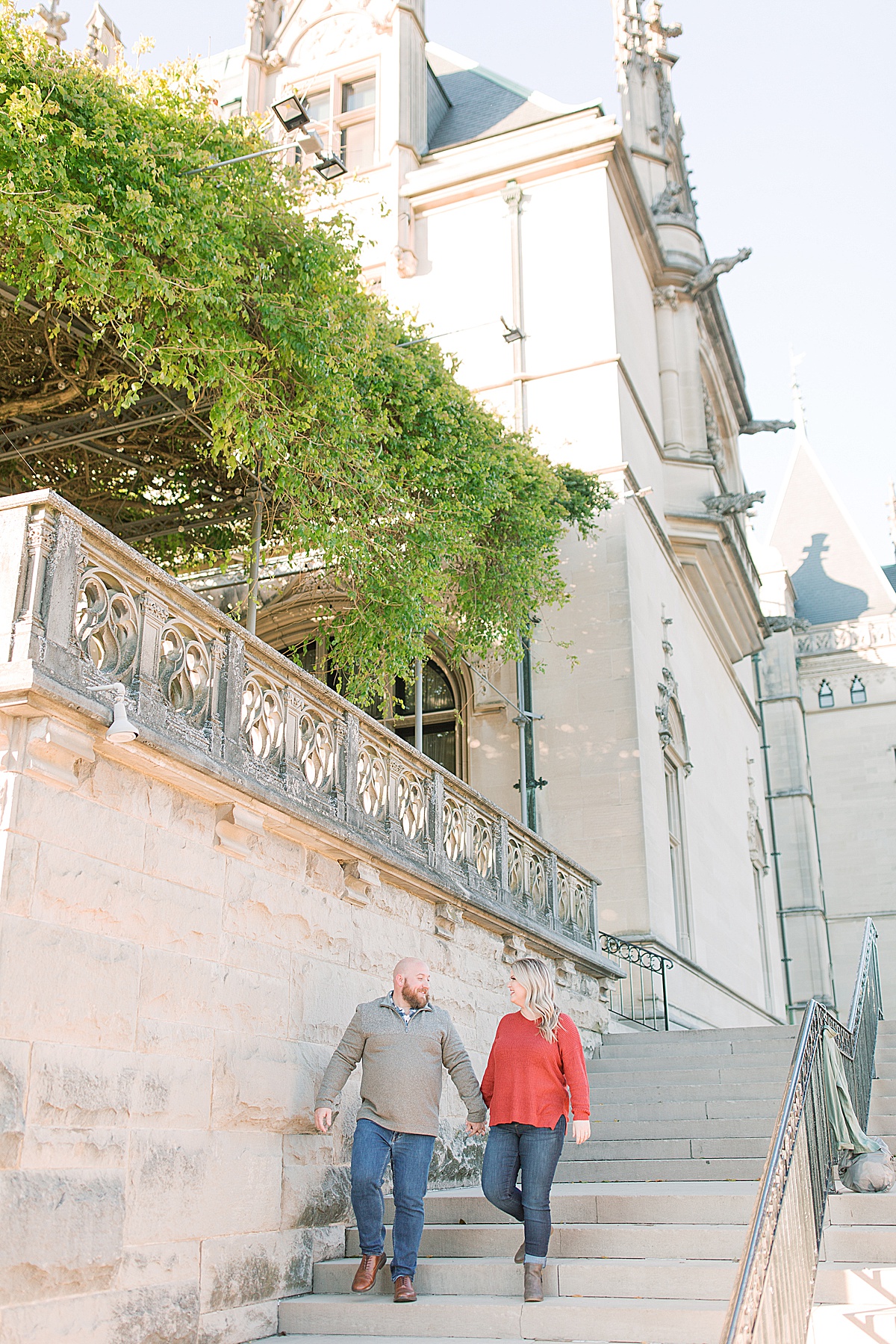 Biltmore Estate Engagement Session Couple Walking Down Stairs Photo