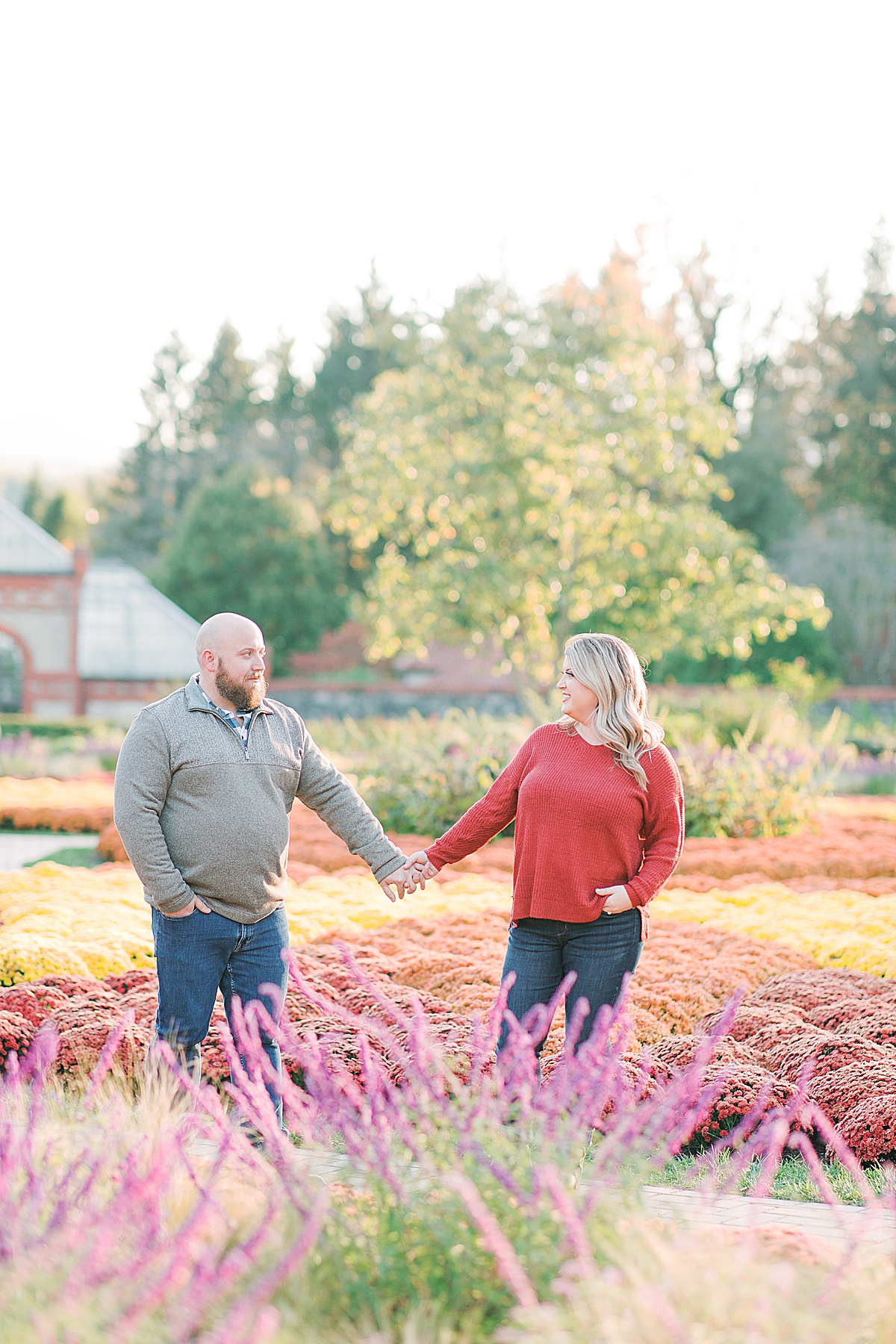 Biltmore Estate Engagement Session Couple Holding Hands in Garden Photo