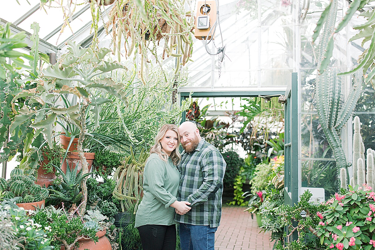 Biltmore Estate Engagement Session Couple Smiling at Camera in Conservatory Photo