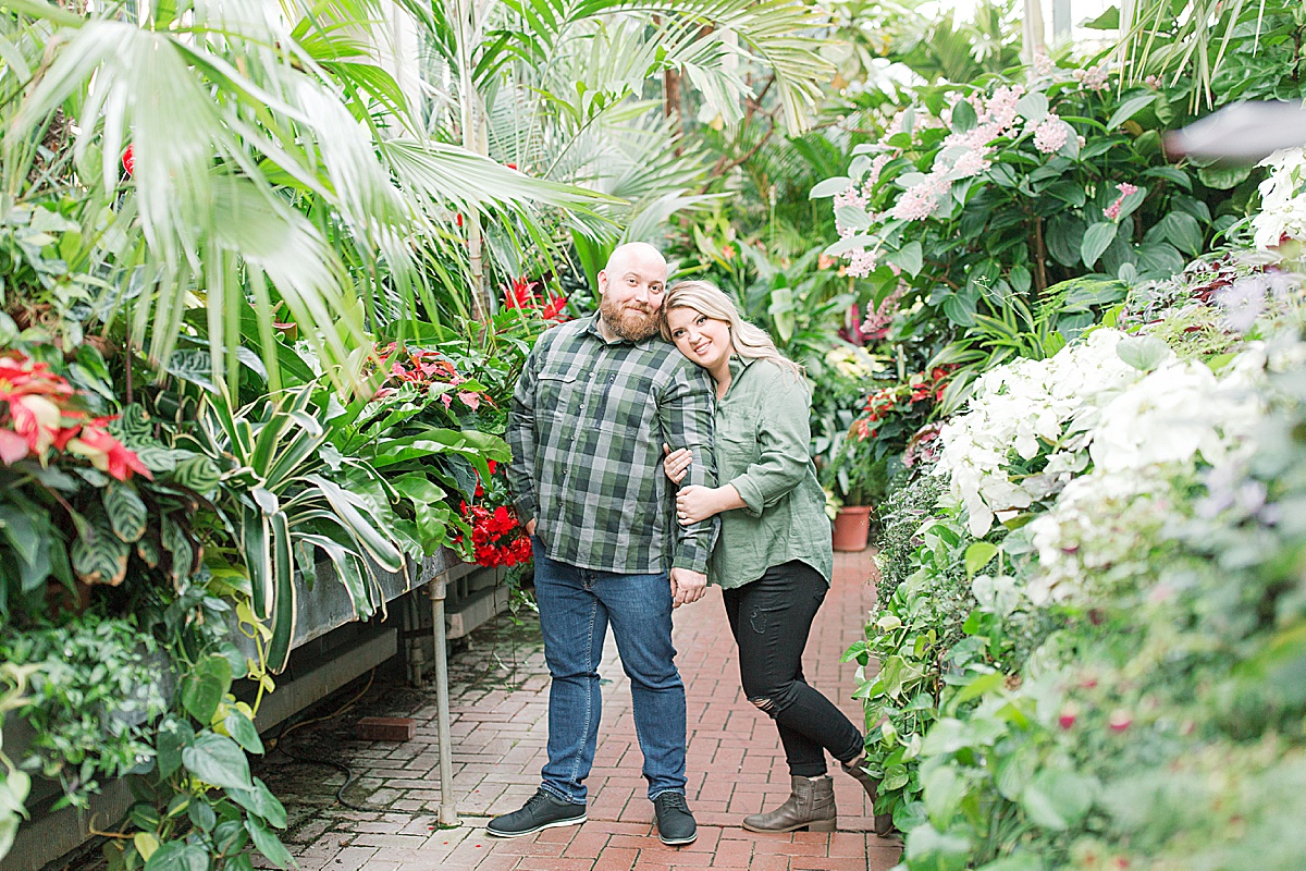Biltmore Estate Engagement Session Couple Smiling at Camera in Conservatory Photo