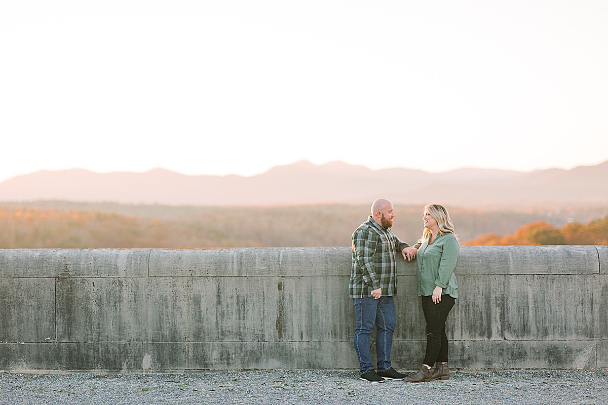 Biltmore Estate Engagement Session Couple Holding Hands with Mountains in Background Photo