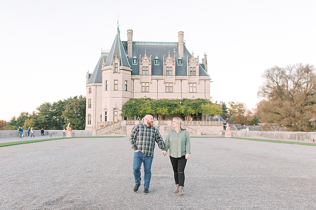 Biltmore Estate Engagement Session Couple Holding Hands and Walking Toward Camera Photo