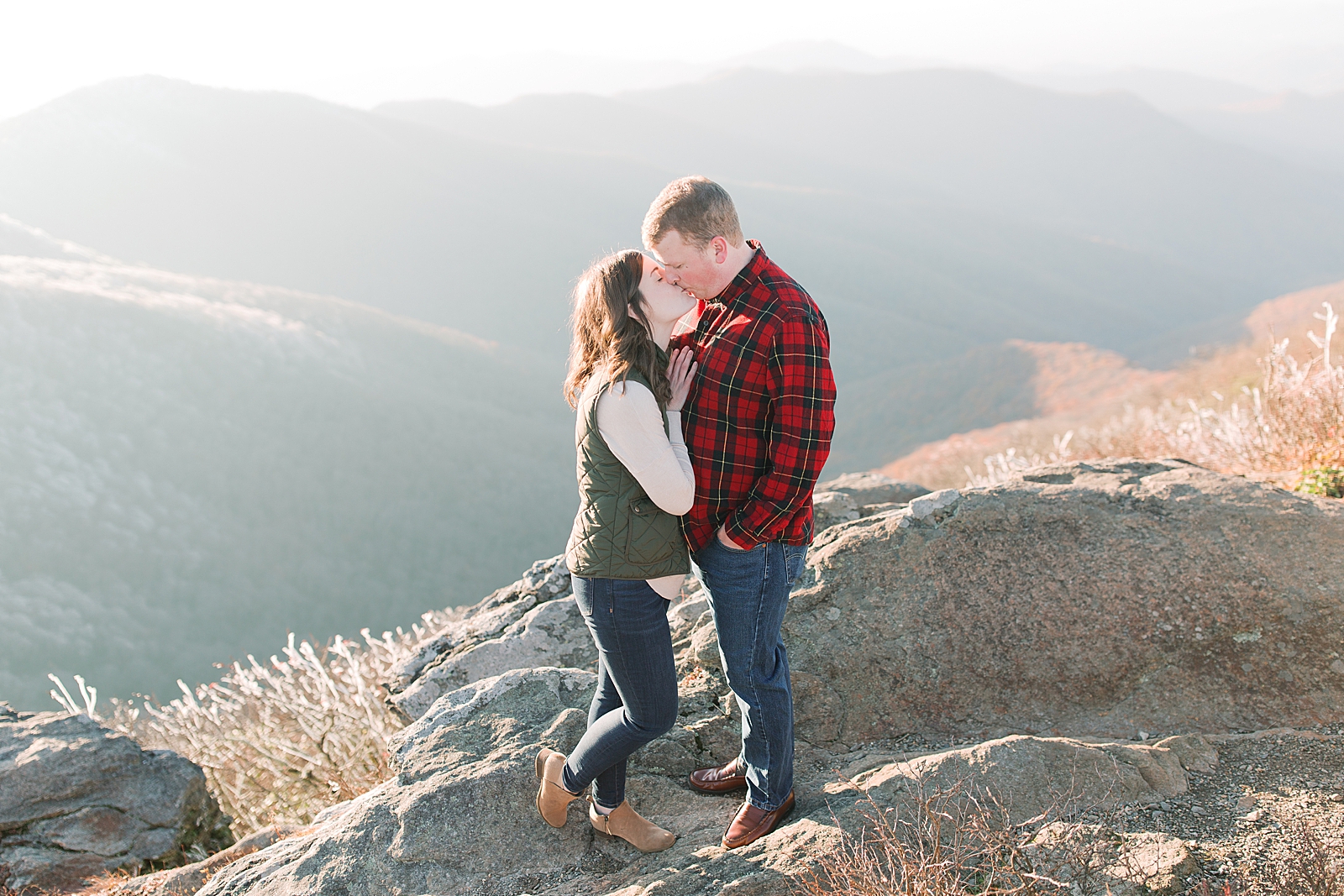 Craggy Gardens Trail Engagement Session Couple Kissing with Mountains in the Background Photo