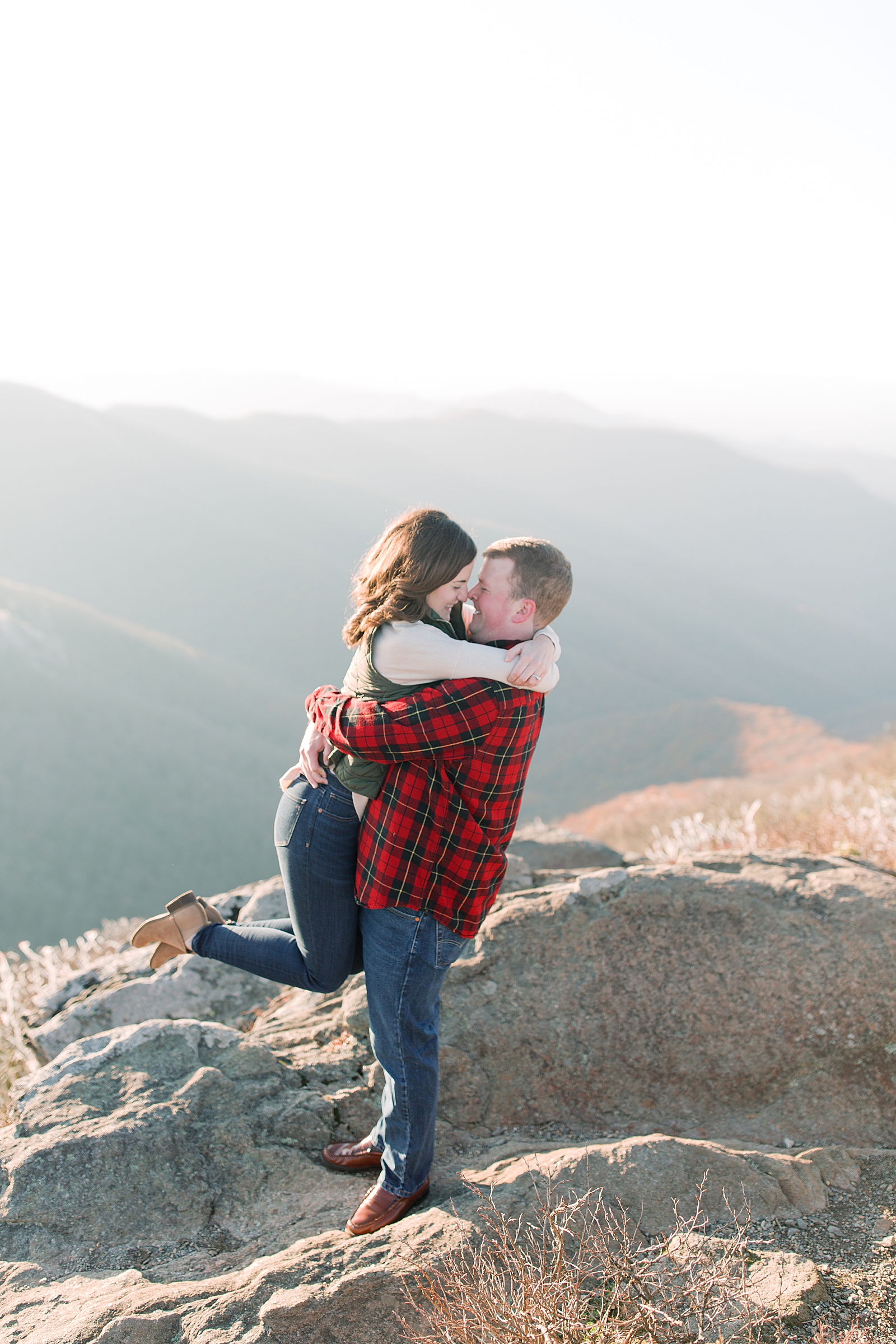 Craggy Gardens Trail Engagement Session Couple Hugging and Smiling Photo