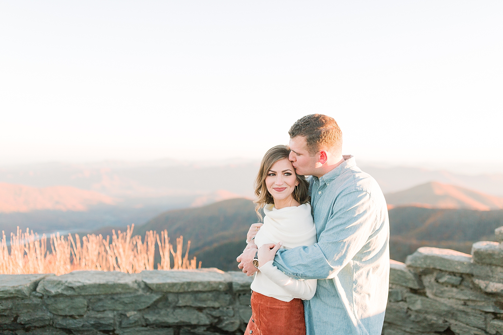 Craggy Gardens Engagement Ross Kissing Maddie on Forehead Photo