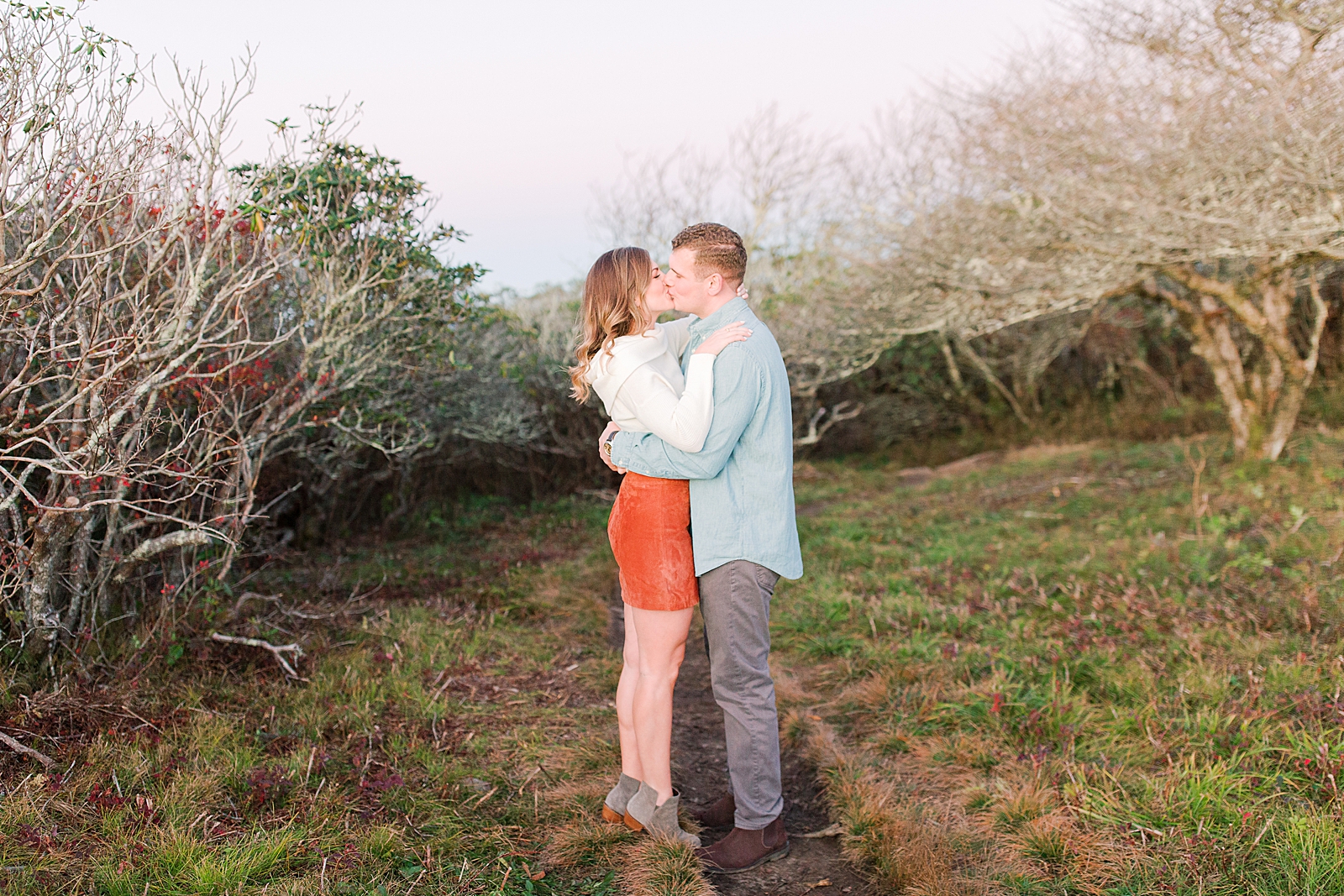 Craggy Gardens Engagement Maddie on Tiptoes Kissing Ross Photo