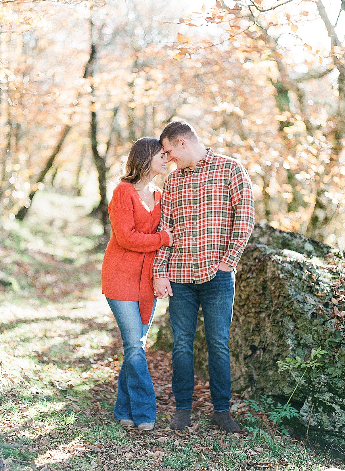 Craggy Gardens Engagement Couple Snuggling Nose to Nose Holding Hands Photo