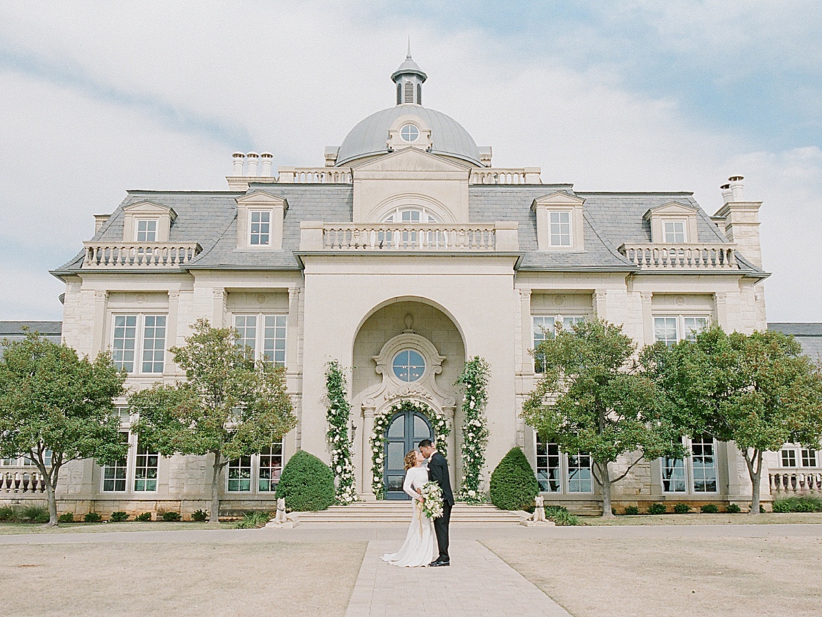Bride and Groom Hugging at Front Terrace of The Olana in Texas 