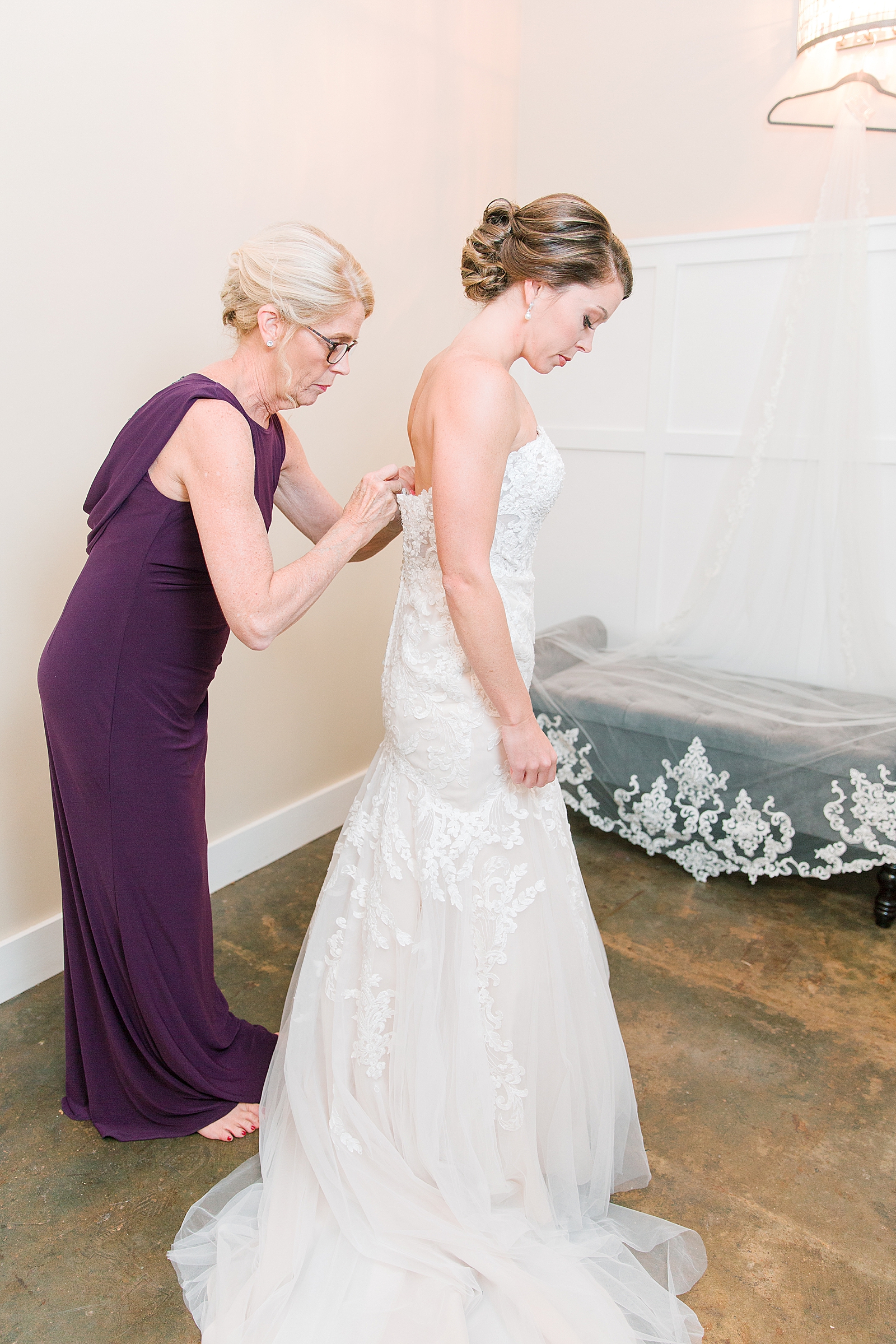 The Hackney Warehouse Wedding Mother Buttoning Brides Dress Photo