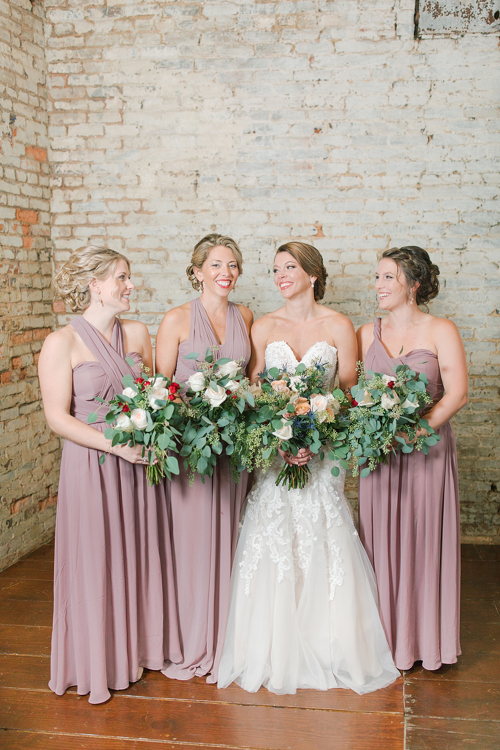 The Hackney Warehouse Bride Laughing with Bridesmaids Photo