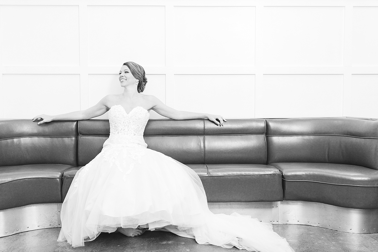 The Hackney Warehouse Black and White of Bride on Bench Laughing Photo