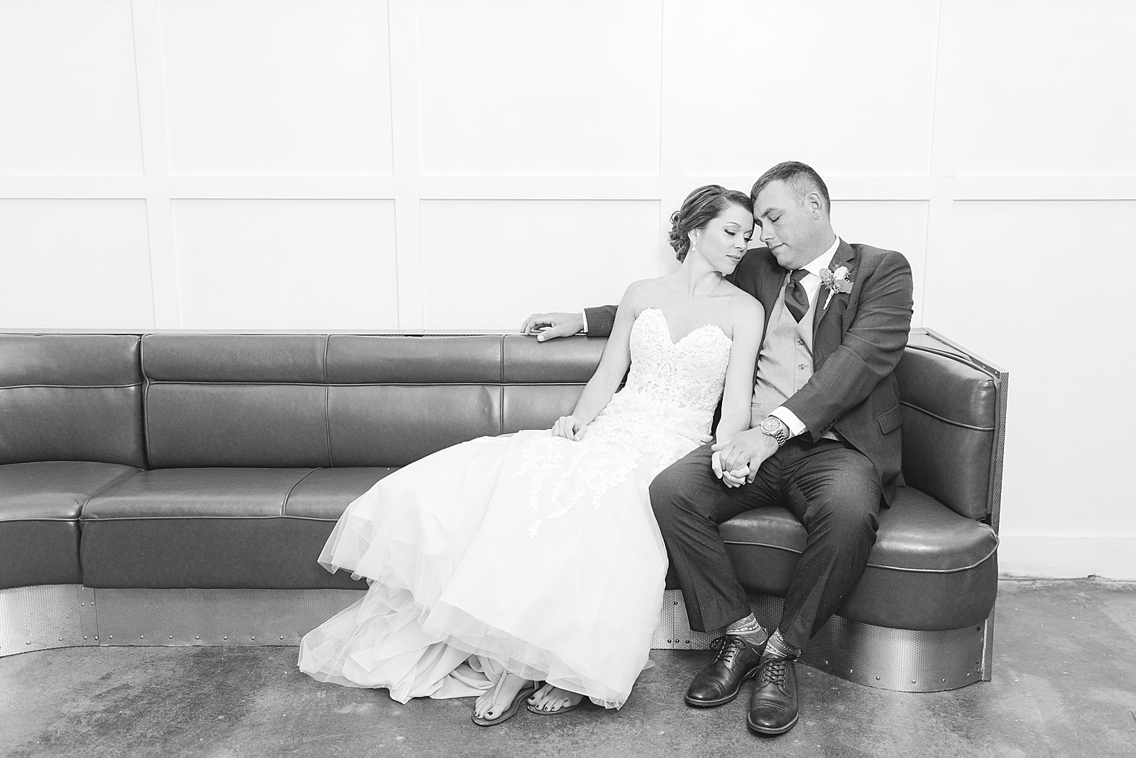 The Hackney Warehouse Black and White of Couple Sitting and Snuggling on Bench Photo