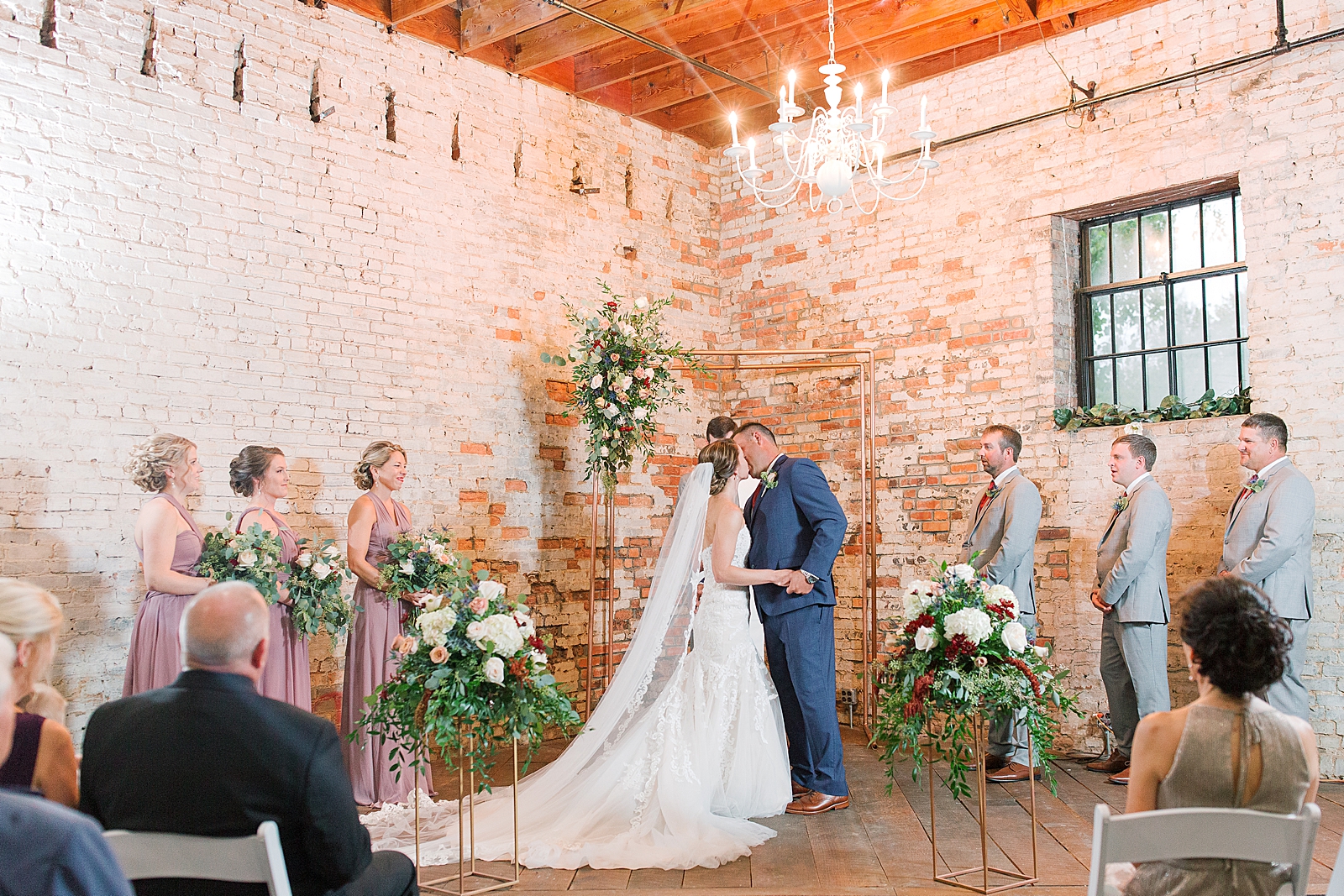 The Hackney Warehouse Bride and Grooms First Kiss Photo