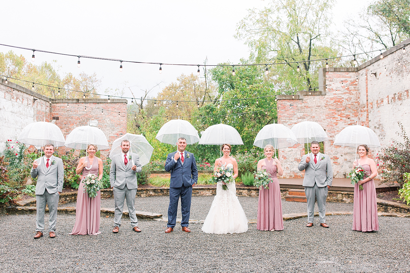 The Hackney Warehouse Bridal Party with Umbrellas In The Rain Photo