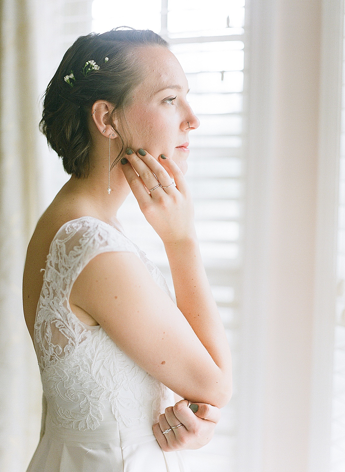 Bride Looking out window at Hewitt Oaks Photo 
