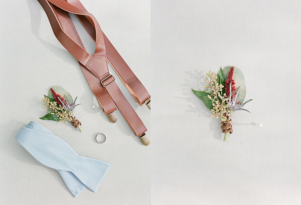 Grooms Details Suspenders Bowtie Ring and Boutonnière Photos 