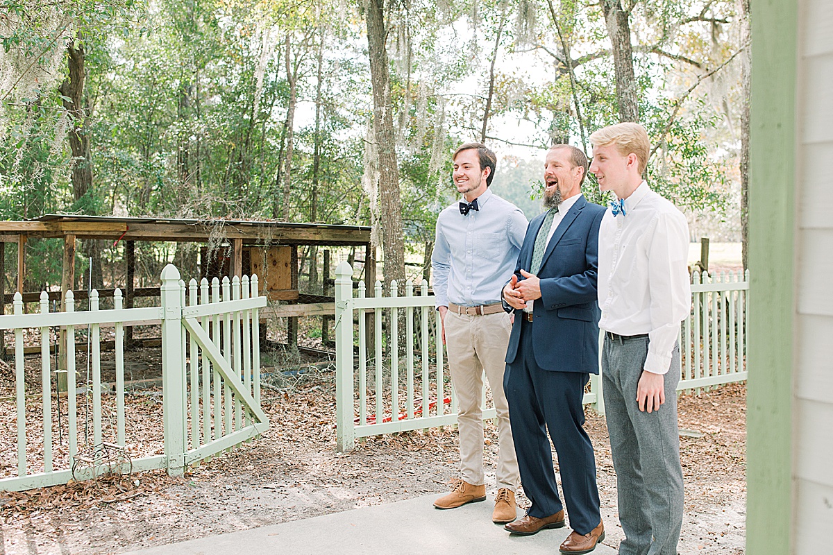 Brides First Look with Dad and Brothers at Hewitt Oaks Wedding Photo 