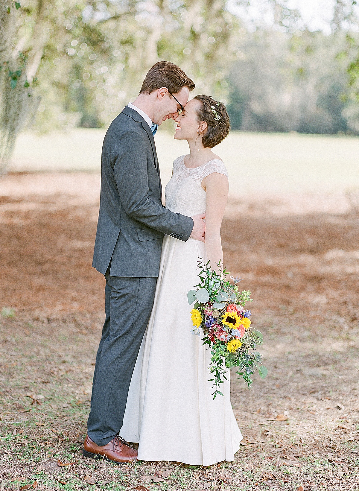 Bride and Groom Nose to Nose under Bluffton SC trees Photo 